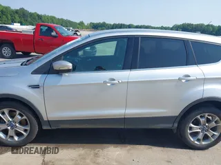 2013 Ford Escape SEL with VIN 1FMCU9H99DUA11243, listed as a IAAI auction lot 42356731 with 154,937 mi miles and . Bid and sale history available at DreamBid. Image 14.