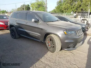 2015 Jeep Grand Cherokee SRT with VIN 1C4RJFDJ9FC842448, listed as a IAAI auction lot 41850385 with 178,439 mi miles. Bid and sale history available at carsss.com. Image 1.