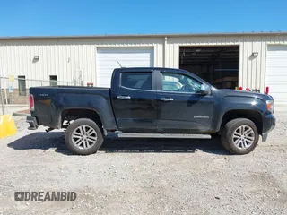 2015 GMC Canyon 2WD SLT with VIN 1GTG5CE35F1249224, listed as a IAAI auction lot 41697796 with 180,230 mi miles. Bid and sale history available at carsss.com. Image 13.