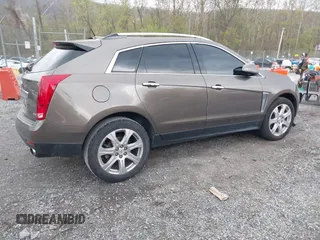 2014 Cadillac SRX Performance Collection with VIN 3GYFNCE33ES570472, listed as a IAAI auction lot 41971511 with 200,811 mi miles. Bid and sale history available at carsss.com. Image 4.