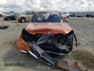 2025 BMW X1 xDrive28i with VIN WBX73EF03S5094250, listed as a Copart auction lot 51174465 with 51 mi miles and Salvage title. Bid and sale history available at DreamBid. Image 5.