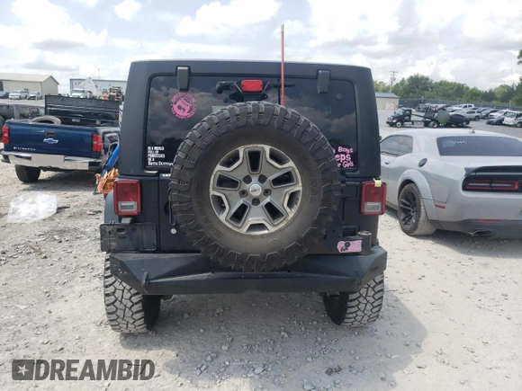 2014 Jeep Wrangler Unlimited Rubicon with VIN 1C4BJWFGXEL291187, listed as a Copart auction lot 54897675 with 227,478 mi miles and Salvage title. Bid and sale history available at DreamBid. Image 6.