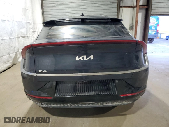 2023 Kia EV6 Wind with VIN KNDC34LA9P5604093, listed as a Copart auction lot 46487755 with 26,682 mi miles and Salvage Title. Bid and sale history available at carsss.com. Image 6.