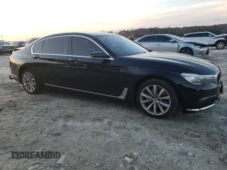 2017 BMW 7 Series 740i xDrive with VIN WBA7E4C55HGU99795, listed as a Copart auction lot 85545124 with 99,304 mi miles and Salvage Title. Bid and sale history available at carsss.com. Image 4.