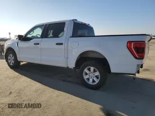 2021 Ford F-150 XL with VIN 1FTEW1CP8MFD11312, listed as a Copart auction lot 88754605 with 142,224 mi miles and Salvage title. Bid and sale history available at DreamBid. Image 2.