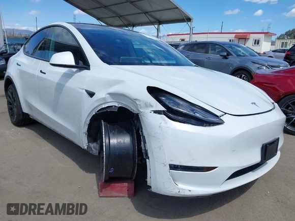 2020 Tesla Model Y Long Range with VIN 5YJYGDEE2LF058515, listed as a IAAI auction lot 41932748 with 62,885 mi miles and . Bid and sale history available at DreamBid. Image 1.