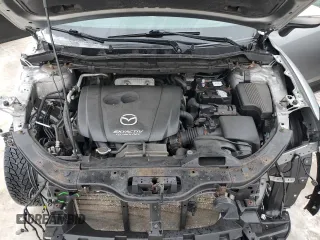 2015 Mazda CX-5 Sport with VIN JM3KE4BEXF0499688, listed as a Copart auction lot 88988095 with 258,460 mi miles and Salvage title. Bid and sale history available at DreamBid. Image 12.