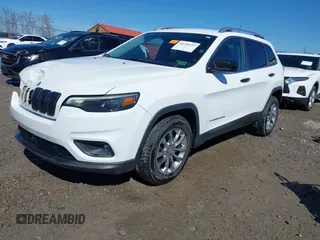2021 Jeep Cherokee Altitude with VIN 1C4PJLLBXMD164087, listed as a IAAI auction lot 41694113 with 76,352 mi miles. Bid and sale history available at carsss.com. Image 2.
