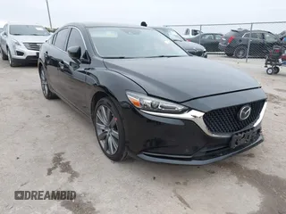2020 Mazda 6 Grand Touring with VIN JM1GL1TY5L1513949, listed as a IAAI auction lot 40953540 with 55,616 mi miles and . Bid and sale history available at carsss.com. Image 1.