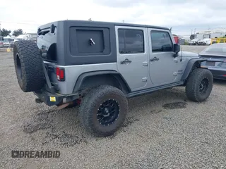 2018 Jeep Wrangler Unlimited Sport S with VIN 1C4BJWDG4JL861052, listed as a IAAI auction lot 42100517 with 43,907 mi miles and . Bid and sale history available at DreamBid. Image 4.