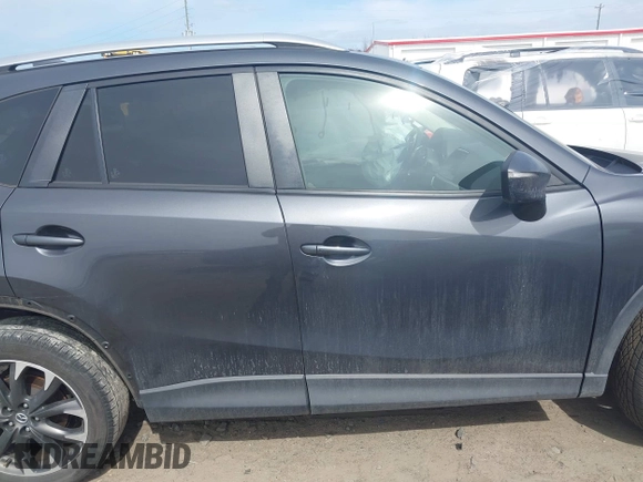2016 Mazda CX-5 Grand Touring with VIN JM3KE4DY9G0845707, listed as a IAAI auction lot 41709685 with 96,351 mi miles. Bid and sale history available at carsss.com. Image 13.