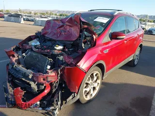 2013 Ford Escape Titanium with VIN 1FMCU0J96DUA57425, listed as a IAAI auction lot 40458653 with 121,929 mi miles. Bid and sale history available at carsss.com. Image 2.