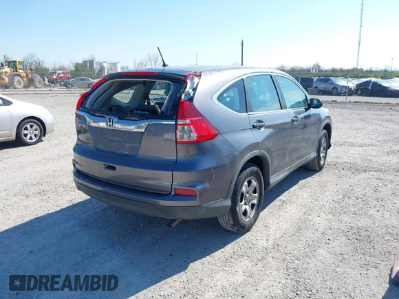 2015 Honda CR-V LX with VIN 2HKRM3H31FH557779, listed as a IAAI auction lot 42098299 with 211,683 mi miles and . Bid and sale history available at carsss.com. Image 4.