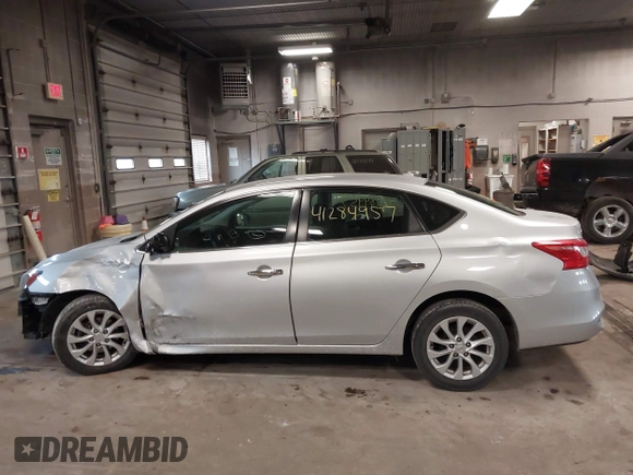 2019 Nissan Sentra S z VIN 3N1AB7AP7KY345072, wystawiony jako IAAI lot #41284957 z przebiegiem 104 084 mil mil oraz . Historia ofert i sprzedaży dostępna na DreamBid. Obrazek 15.