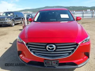 2016 Mazda CX-9 Touring z VIN JM3TCACY9G0122174, wystawiony jako IAAI lot #42613740 z przebiegiem 148 646 mil mil oraz . Historia ofert i sprzedaży dostępna na DreamBid. Obrazek 12.