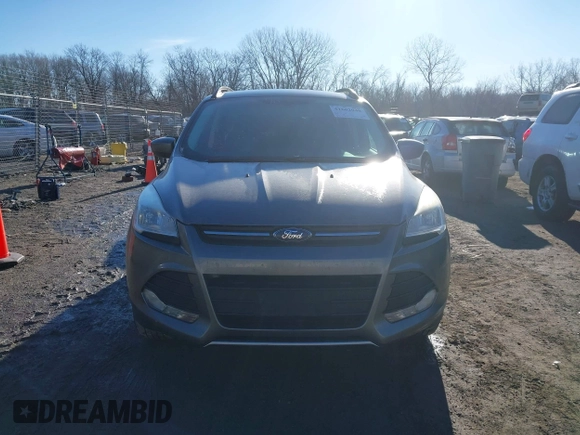 2014 Ford Escape SE z VIN 1FMCU9GXXEUB99093, wystawiony jako IAAI lot #41662040 z przebiegiem 120 783 mil mil oraz . Historia ofert i sprzedaży dostępna na DreamBid. Obrazek 13.