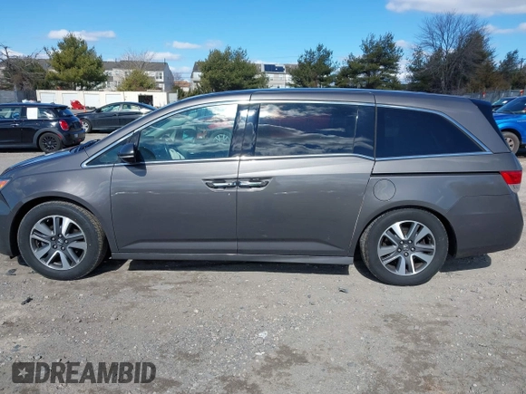 2016 Honda Odyssey Touring Elite with VIN 5FNRL5H90GB128006, listed as a IAAI auction lot 41695438 with 133,337 mi miles. Bid and sale history available at carsss.com. Image 14.