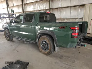 2023 Nissan Frontier Pro-4X z VIN 1N6ED1EK4PN671708, wystawiony jako Copart lot #58271305 z przebiegiem 22 906 mil mil oraz Szkoda całkowita • Salvage title. Historia ofert i sprzedaży dostępna na DreamBid. Obrazek 2.