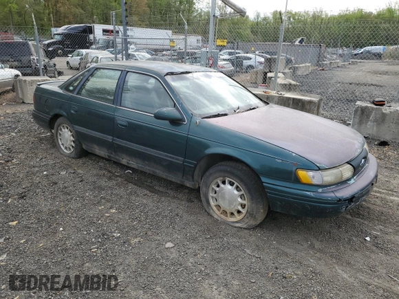1995 Ford Taurus GL with VIN 1FALP52U8SA179395, listed as a Copart auction lot 53614265 with 71,082 mi miles and Salvage title. Bid and sale history available at DreamBid. Image 4.