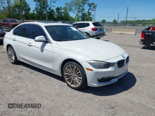 2013 BMW 3 Series 328i xDrive with VIN WBA3B5C51DJ599144, listed as a IAAI auction lot 42059260 with 84,153 mi miles. Bid and sale history available at carsss.com. Image 1.