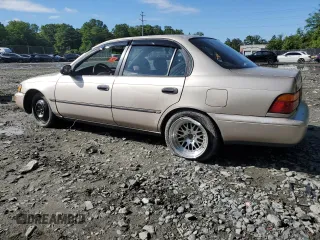 1995 Toyota Corolla DX with VIN 2T1AE09B0SC098739, listed as a Copart auction lot 57653205 with 154,226 mi miles and Salvage title. Bid and sale history available at DreamBid. Image 2.