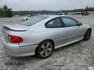 2004 Pontiac GTO z VIN 6G2VX12G74L183006, wystawiony jako Copart lot #58619105 z przebiegiem 281 390 mil mil oraz Tytuł czysty. Historia ofert i sprzedaży dostępna na DreamBid. Obrazek 3.