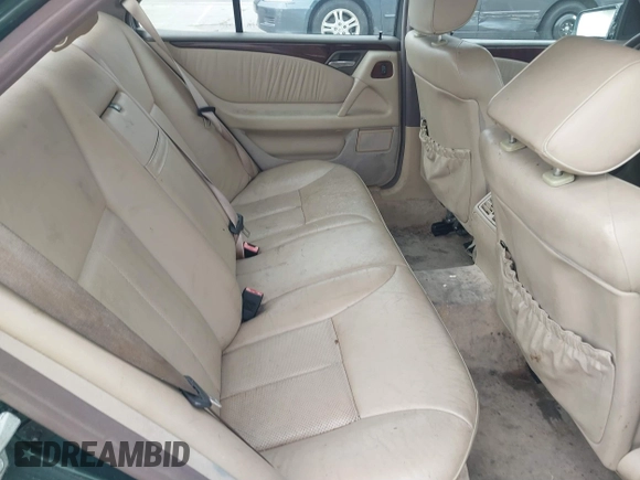 1997 Mercedes-Benz E-Class with VIN WDBJF55F3VJ034009, listed as a IAAI auction lot 41710225 with 239,673 mi miles. Bid and sale history available at carsss.com. Image 8.
