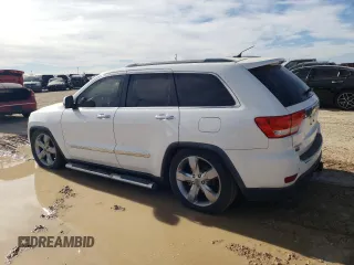 2013 Jeep Grand Cherokee Overland with VIN 1C4RJFCT2DC650336, listed as a Copart auction lot 83830304 with 129,858 mi miles and Clean Title. Bid and sale history available at carsss.com. Image 2.