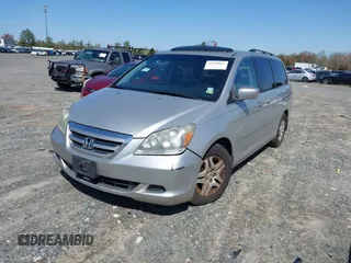 2007 Honda Odyssey EX-L with VIN 5FNRL387X7B080906, listed as a IAAI auction lot 41910061 with 229,717 mi miles and . Bid and sale history available at DreamBid. Image 2.