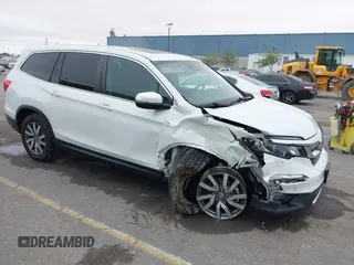 2020 Honda Pilot EX-L with VIN 5FNYF6H59LB059154, listed as a IAAI auction lot 42584799 with 56,532 mi miles and . Bid and sale history available at DreamBid. Image 1.