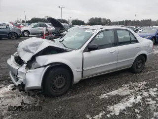 2000 Mazda Protege DX z VIN JM1BJ2226Y0235417, wystawiony jako Copart lot #59469395 z przebiegiem 173 126 mil mil oraz Nie do naprawy • Non repairable. Historia ofert i sprzedaży dostępna na DreamBid. Obrazek 1.
