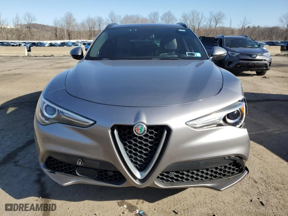 2018 Alfa Romeo Stelvio Ti Sport with VIN ZASFAKNN3J7C19932, listed as a Copart auction lot 49765385 with 103,018 mi miles and Salvage Title. Bid and sale history available at carsss.com. Image 5.