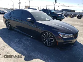 2019 BMW 7 Series 750i with VIN WBA7F0C56KGM25430, listed as a Copart auction lot 42048135 with 74,717 mi miles and Salvage title. Bid and sale history available at DreamBid. Image 4.