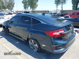 2018 Honda Clarity Touring with VIN JHMZC5F39JC022655, listed as a IAAI auction lot 42149002 with 118,913 mi miles. Bid and sale history available at carsss.com. Image 3.