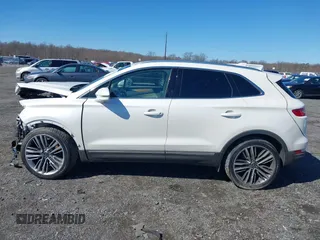 2015 Lincoln MKC with VIN 5LMTJ2AH8FUJ31911, listed as a IAAI auction lot 41735017 with 76,332 mi miles. Bid and sale history available at carsss.com. Image 14.