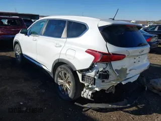 2019 Hyundai Santa Fe SE with VIN 5NMS2CAD2KH020288, listed as a IAAI auction lot 41398304 with 136,693 mi miles and . Bid and sale history available at DreamBid. Image 3.