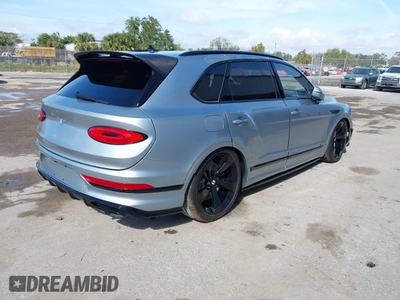 2022 Bentley Bentayga V8 z VIN SJAAM2ZV9NC011752, wystawiony jako IAAI lot #41265000 z przebiegiem Nie podano mil oraz . Historia ofert i sprzedaży dostępna na DreamBid. Obrazek 4.