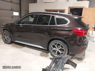 2016 BMW X1 xDrive28i with VIN WBXHT3C33GP886935, listed as a IAAI auction lot 41707367 with 73,201 mi miles. Bid and sale history available at carsss.com. Image 3.