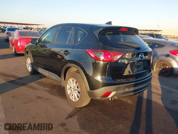 2016 Mazda CX-5 Touring with VIN JM3KE2CY5G0704574, listed as a IAAI auction lot 41033546 with 133,502 mi miles. Bid and sale history available at carsss.com. Image 3.