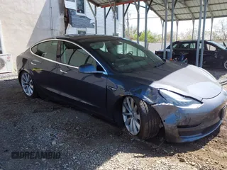 2019 Tesla Model 3 Mid Range z VIN 5YJ3E1EA3KF412603, wystawiony jako IAAI lot #42092260 z przebiegiem 69 729 mil mil oraz . Historia ofert i sprzedaży dostępna na DreamBid. Obrazek 1.
