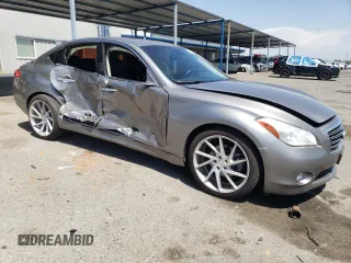 2013 Infiniti M with VIN JN1BY1AP2DM511973, listed as a Copart auction lot 55351815 with 126,888 mi miles and Salvage title. Bid and sale history available at DreamBid. Image 4.