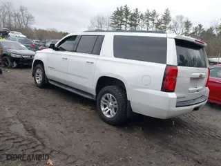 2016 Chevrolet Suburban LT with VIN 1GNSKHKC2GR182080, listed as a IAAI auction lot 41666445 with 148,661 mi miles. Bid and sale history available at carsss.com. Image 3.