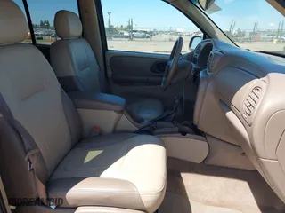 2004 Chevrolet TrailBlazer LT with VIN 1GNDS13S842376090, listed as a IAAI auction lot 42075638 with 112,519 mi miles. Bid and sale history available at carsss.com. Image 5.