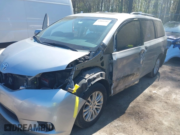 2015 Toyota Sienna XLE with VIN 5TDYK3DC0FS558486, listed as a IAAI auction lot 42064281 with 211,119 mi miles and . Bid and sale history available at DreamBid. Image 6.