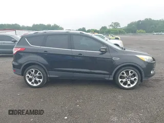 2015 Ford Escape Titanium z VIN 1FMCU0JX7FUB00462, wystawiony jako IAAI lot #42532943 z przebiegiem 88 623 mil mil oraz . Historia ofert i sprzedaży dostępna na DreamBid. Obrazek 13.