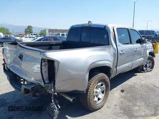 2018 Toyota Tacoma SR with VIN 5TFAX5GN2JX103685, listed as a IAAI auction lot 42392032 with 138,678 mi miles and . Bid and sale history available at DreamBid. Image 4.