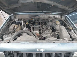 1997 Jeep Cherokee Sport with VIN 1J4FJ68S9VL607515, listed as a IAAI auction lot 41216502 with 238,274 mi miles. Bid and sale history available at carsss.com. Image 10.