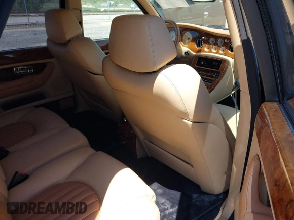 1999 Bentley Arnage z VIN SCBLB51E1XCX01401, wystawiony jako IAAI lot #42133144 z przebiegiem 29 699 mil mil oraz . Historia ofert i sprzedaży dostępna na DreamBid. Obrazek 8.