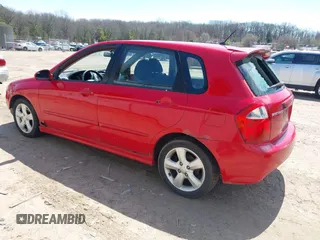 2009 Kia Spectra with VIN KNAFE241995024997, listed as a IAAI auction lot 42095812 with 217,555 mi miles. Bid and sale history available at carsss.com. Image 3.