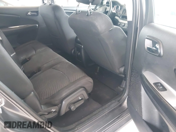 2015 Dodge Journey SE z VIN 3C4PDCAB1FT617794, wystawiony jako IAAI lot #41922371 z przebiegiem 130 558 mil mil oraz . Historia ofert i sprzedaży dostępna na DreamBid. Obrazek 8.